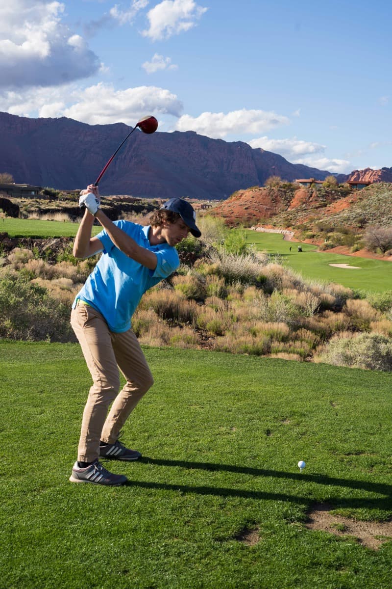 Backswing on a red rock desert course in Utah