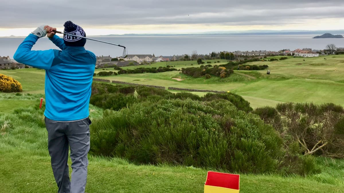 Tee shot on a Scottish links course overlooking the coast