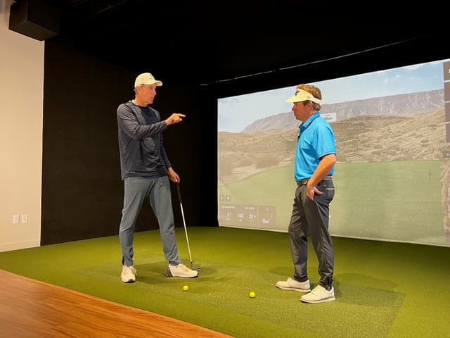 Golfer practicing in a TrackMan studio bay — the coaching context behind MotionEdge