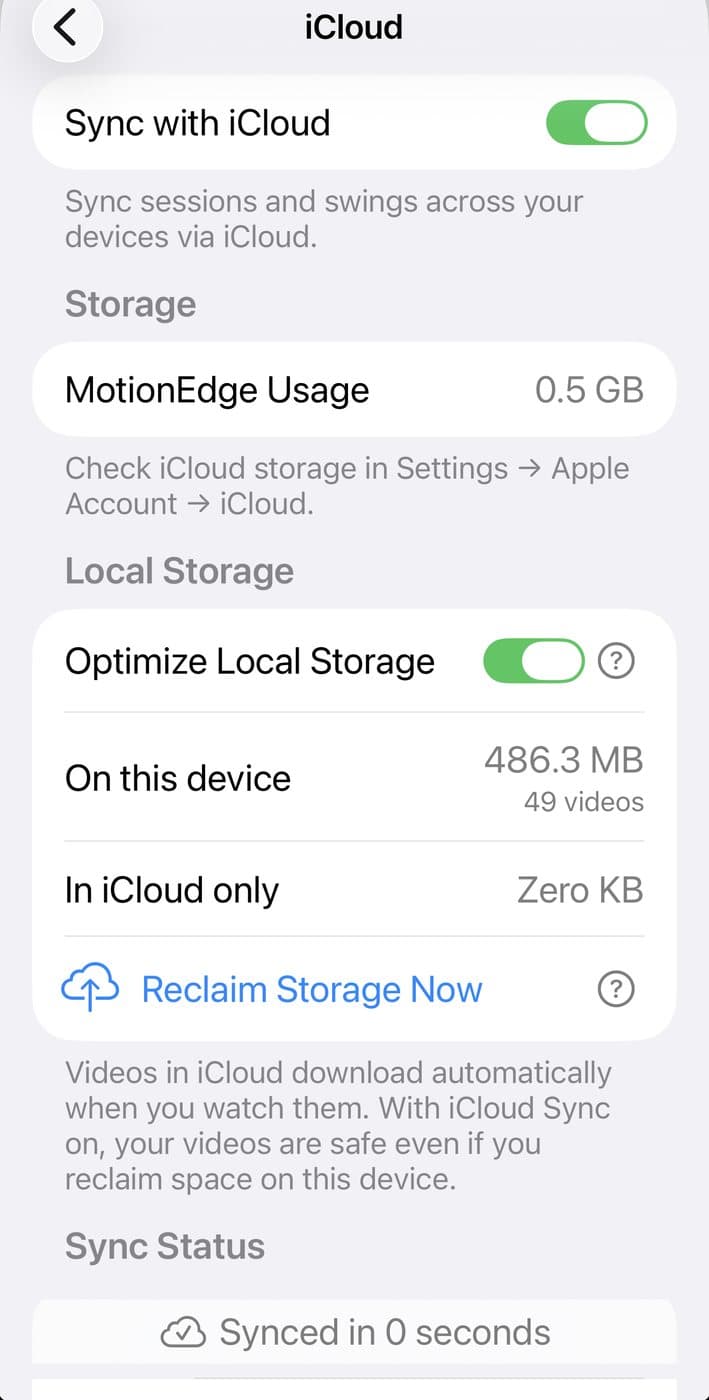 The MotionEdge iCloud settings screen on iPhone: Sync with iCloud switched on, MotionEdge using 0.5 GB of iCloud storage, Optimize Local Storage switched on with 486.3 MB across 49 videos on the device and zero KB held in iCloud only, a Reclaim Storage Now action, and a Sync Status reading "Synced in 0 seconds"