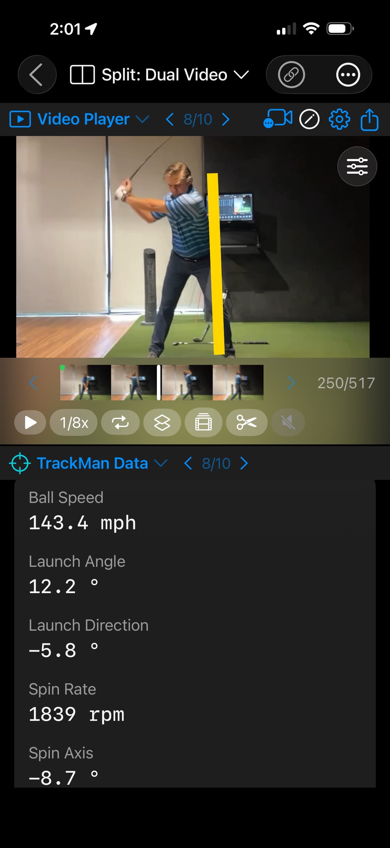 MotionEdge Split: Dual Video mode showing a swing recorded in a TrackMan studio bay alongside live launch monitor data — Ball Speed 143.4 mph, Launch Angle 12.2°, Launch Direction -5.8°, Spin Rate 1839 rpm, Spin Axis -8.7°