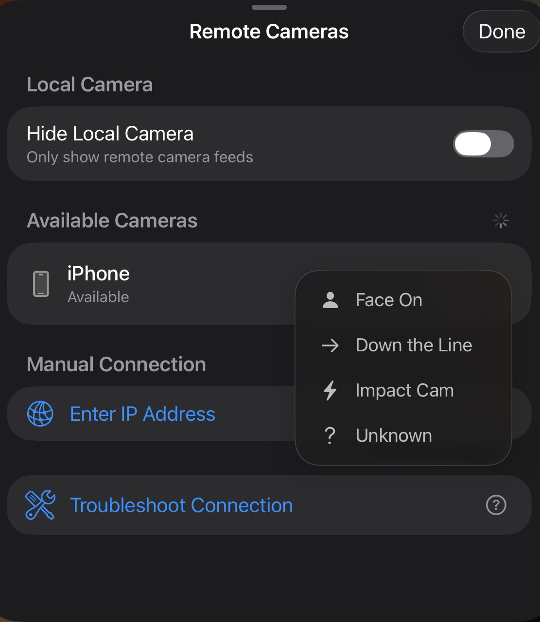 The Remote Cameras sheet — an available iPhone with an angle menu open showing Face On, Down the Line, Impact Cam, and Unknown